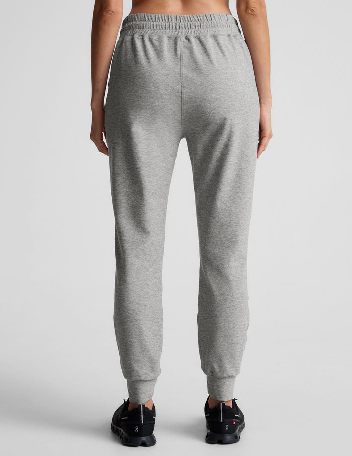 Back view of gray marled Spacedye Commuter Midi Jogger with a high elastic waistband, slim fit, and banded ankle cuffs.