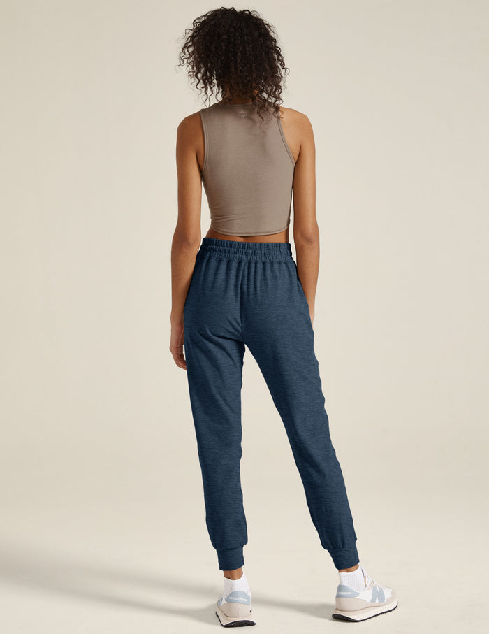 Back view of navy Spacedye Commuter Midi Jogger with a marled texture, gathered elastic waistband, and slim leg fit.