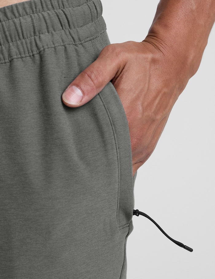 Close-up of the side zipper pocket and marled fabric on a dark grey Spacedye Freefit Men's Zipper Pockets Jogger.