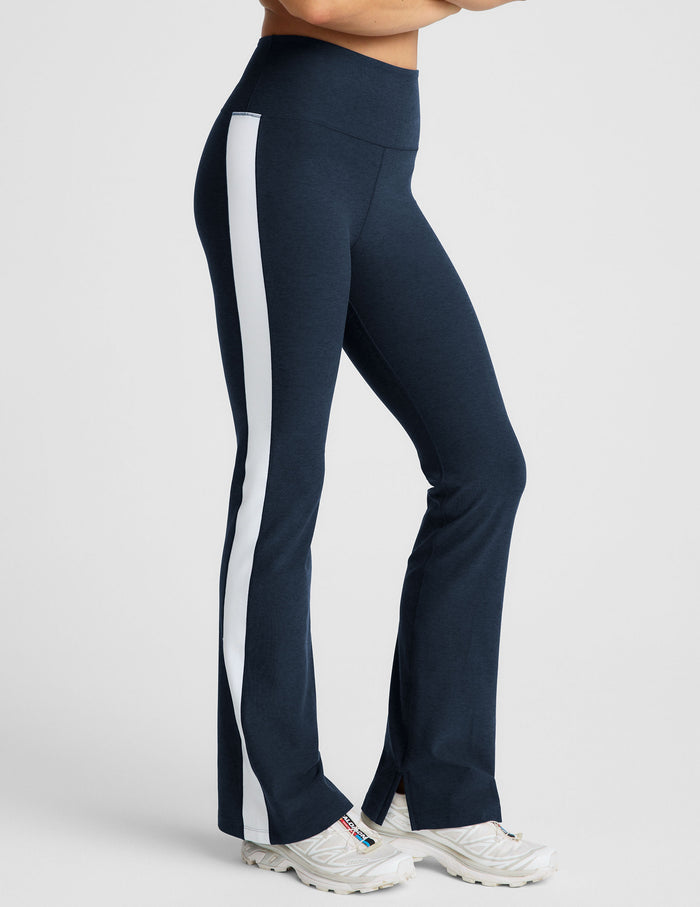 Navy Spacedye Gemini Colorblock Side Slit Pant in navy with a white side stripe, wide waistband, and flared leg with slits.
