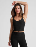 black waist length, V neckline​ tank top with a self shelf bra and criss-cross strap back detail​.
