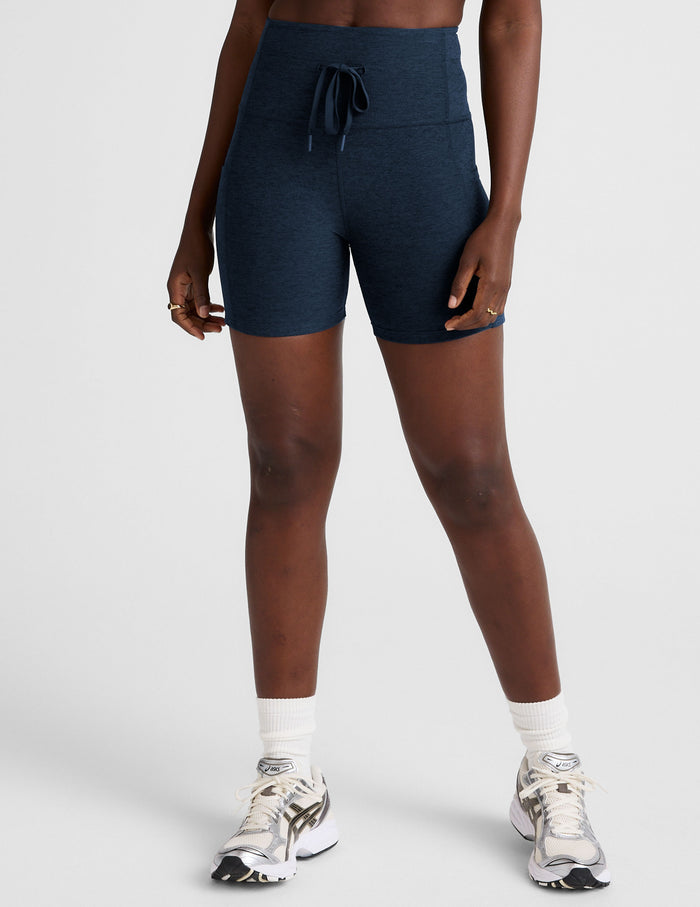 Navy Spacedye Go Pocket 5" Short with high drawstring waist and side pockets on a model wearing white sneakers.