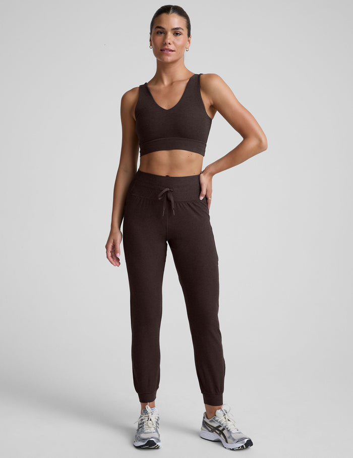 Brown Spacedye Go Pocket Jogger with a high drawstring waistband and cuffed hems, shown on a model against a grey backdrop.