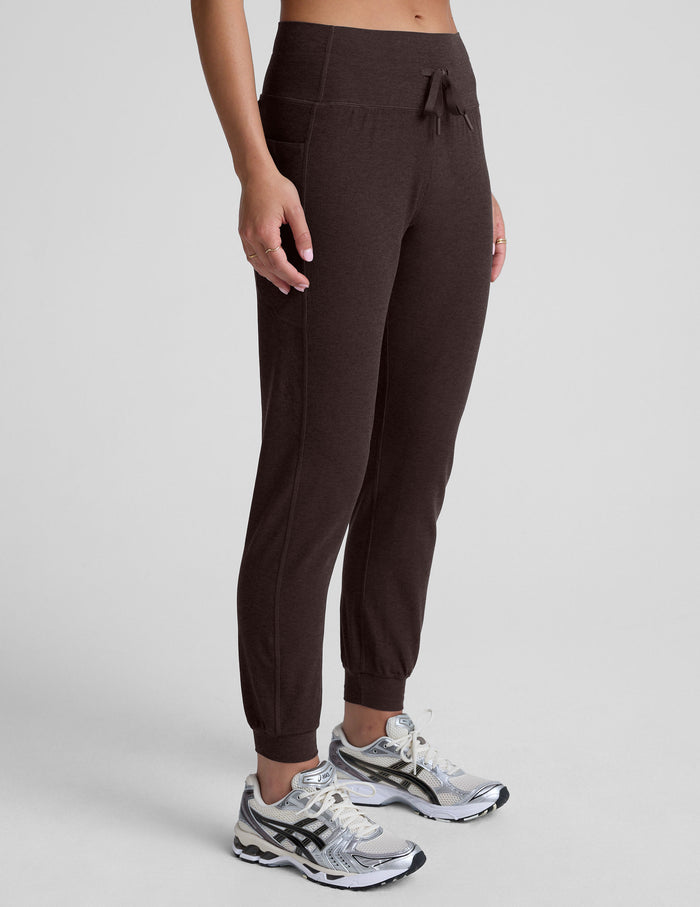 Brown Spacedye Go Pocket Jogger featuring high-waist drawstring, side pockets, and cuffed ankles, shown from a side profile.