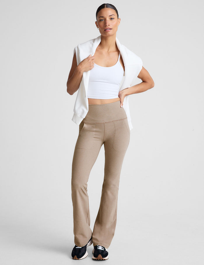 Beige Spacedye High Waisted Practice Pocket Bootcut Pant featuring a tall waistband and slanted pockets on a female model.