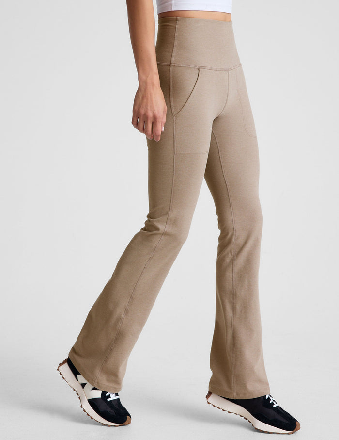 Beige Spacedye High Waisted Practice Pocket Bootcut Pant featuring a high rise, slanted pockets, and flared leg on a model.
