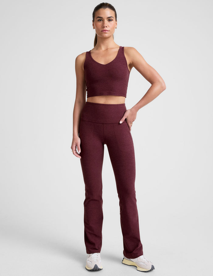 Woman wearing Maroon Spacedye High Waisted Practice Pocket Bootcut Pant with a matching tank and white sneakers.