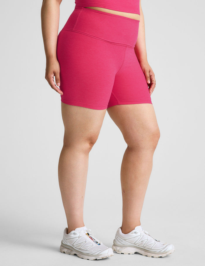 Side view of a person wearing fuchsia Spacedye Keep Pace 5" Short featuring a high waist and marled activewear fabric.