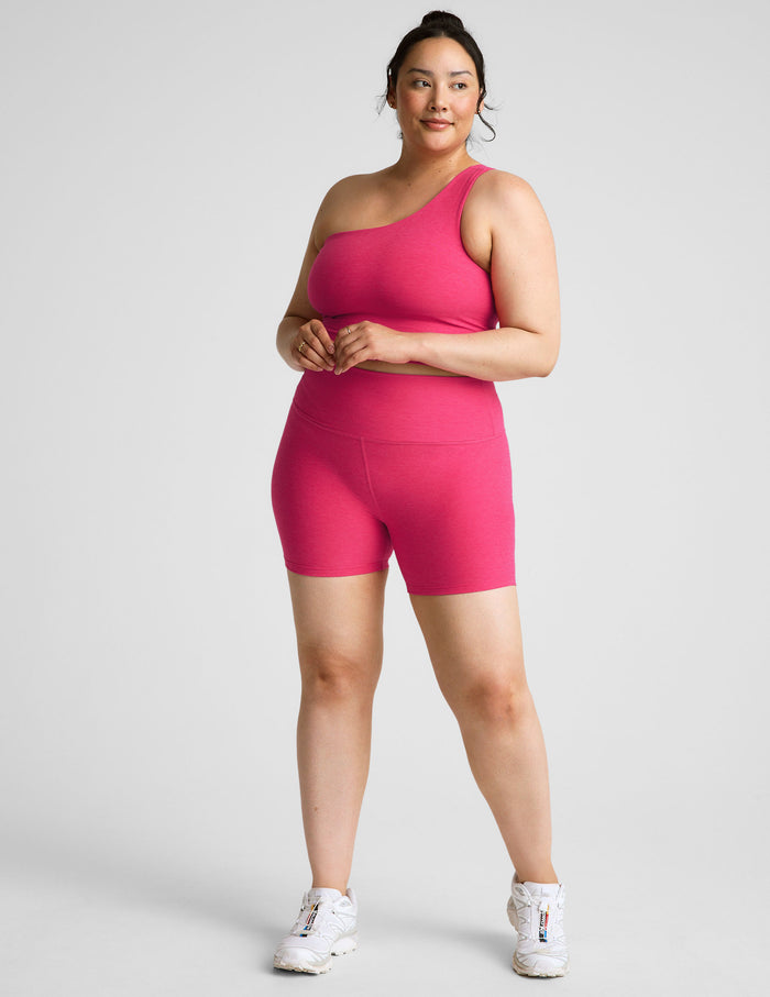 A model wears the fuchsia Spacedye Keep Pace 5" Short, a high-waisted marled pink bike short with a 5-inch inseam.