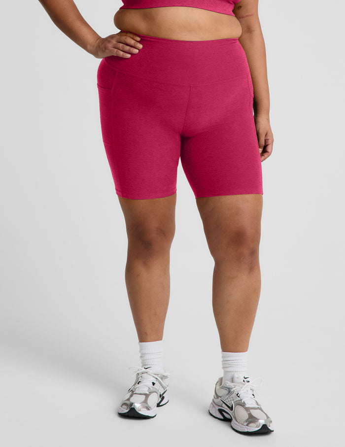 Woman wearing Pink Spacedye™ Keep Pace 7" Pocket Short paired with white socks and silver sneakers.