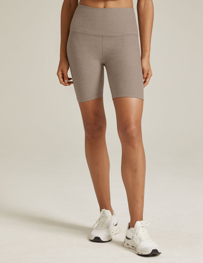 Spacedye High Waisted 7" Biker Short in light brown marled fabric on a model, featuring a high waist and mid-thigh length.
