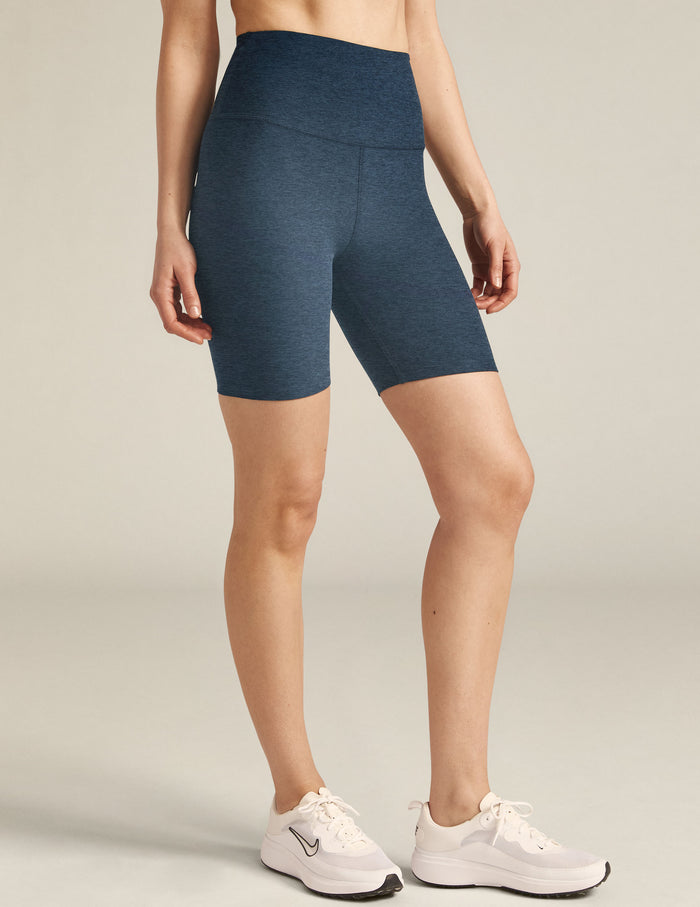 Spacedye High Waisted 7" Biker Short in navy marled fabric, featuring a high-rise waist and snug, mid-thigh fit on model.