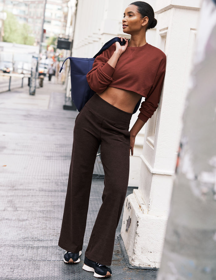 Woman wearing Brown Spacedye Laid Back Wide Leg Pant with a cropped rust sweatshirt and black sneakers.