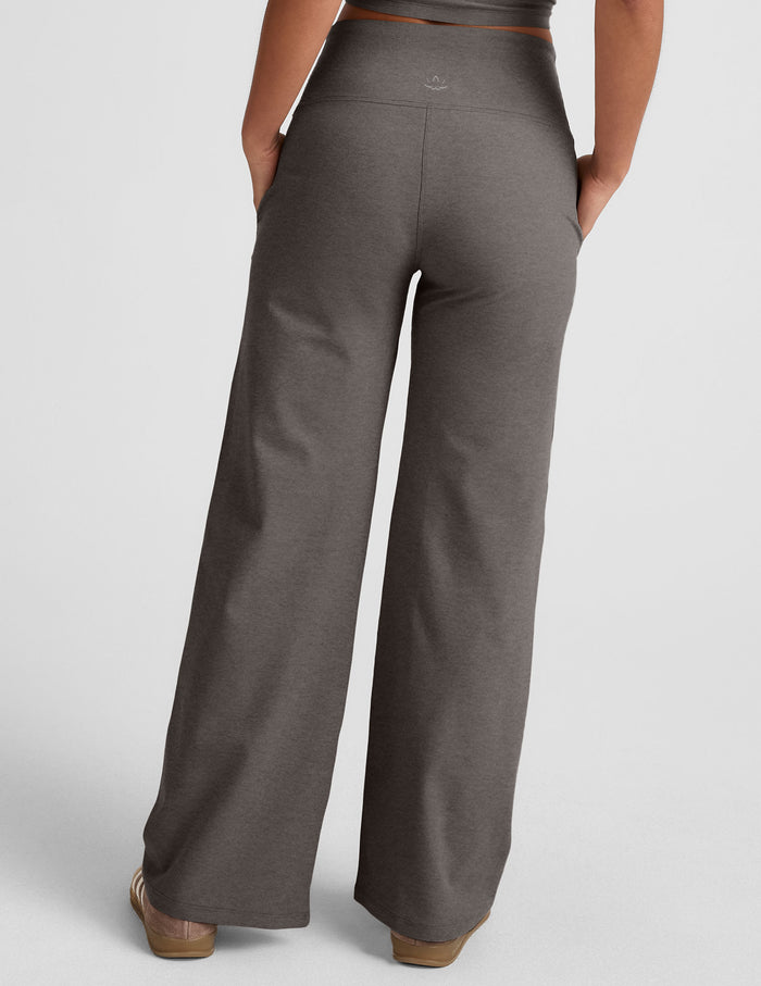 Back view of marled gray Spacedye Laid Back Wide Leg Pant with a high waist, wide legs, and hands in side pockets.