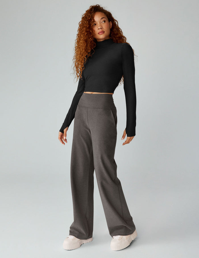 Model wears gray Spacedye Laid Back Wide Leg 31" Pant with high waist and pockets, styled with black top and white sneakers.