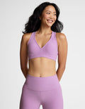 purple bra top with body contoured seams and removable padding.