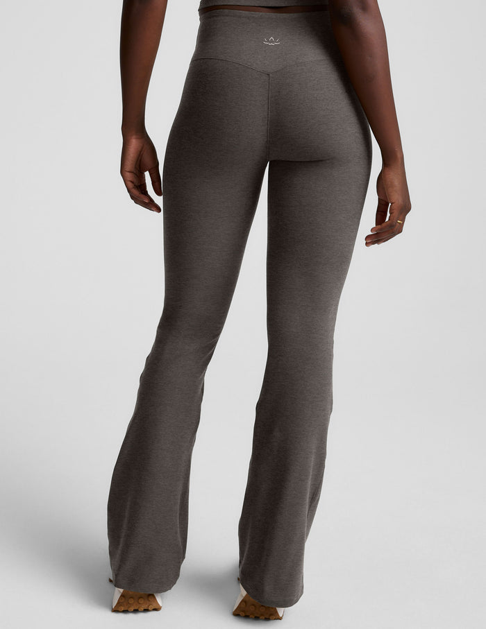 Rear view of gray Spacedye Mid-Rise Bootcut Pant showing the snug fit, wide waistband, and flared legs on a model.