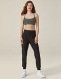 Woman wearing the Spacedye Midi Jogger in marled black featuring a wide waistband and tapered legs with banded cuffs.