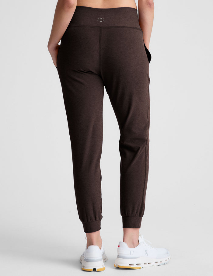 Rear view of dark marled Spacedye Midi Jogger featuring a slim tapered fit, wide waistband, and banded ankle cuffs.