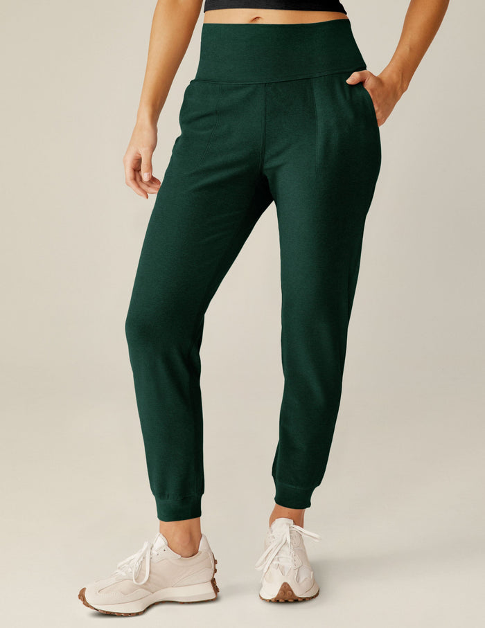 Emerald Spacedye Midi Jogger with wide waistband and tapered leg, shown on a model wearing white athletic sneakers.