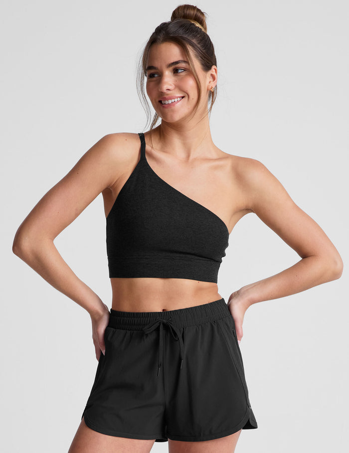 black long line length bra with a one strap detail and open back.