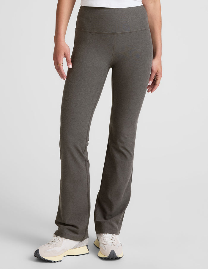 Front view of Spacedye Practice High Waisted Bootcut Pant in dark gray on a model, with a wide waistband and flared legs.