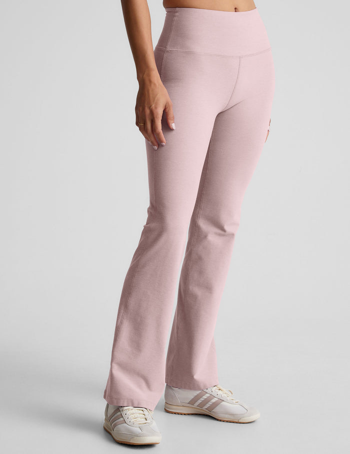 Spacedye Practice High Waisted Bootcut Pant in light pink with a wide waistband and flared legs, shown on a model.