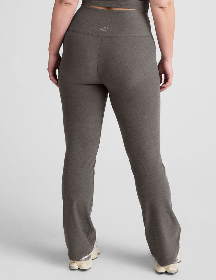 Rear view of gray Spacedye Practice High Waisted Bootcut Pant featuring a wide waistband and snug fit with a flared leg.