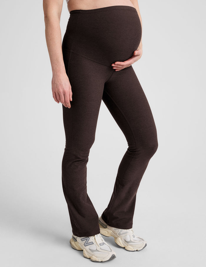 Woman wearing Brown Spacedye™ Practice Maternity Pant in a side profile, paired with cream sneakers.