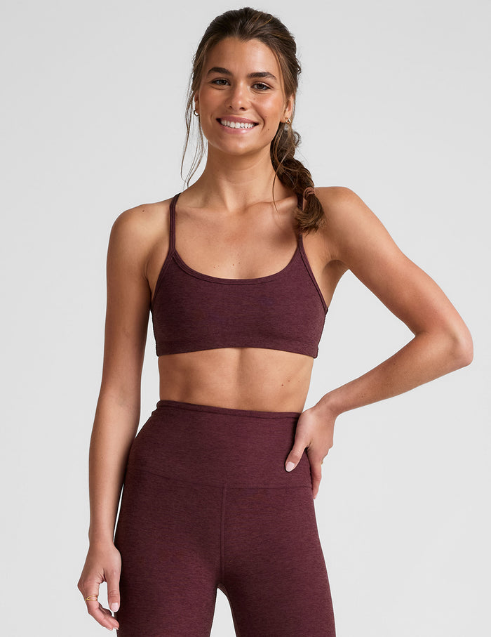 red racerback bra with thin straps.