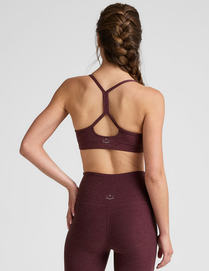 red racerback bra with thin straps.