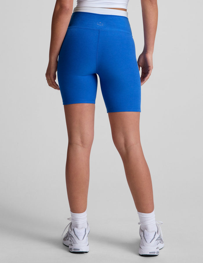 Rear view of Spacedye Trophy 5" Short in bright blue with a high waist, white contrast trim, and mid-thigh length.
