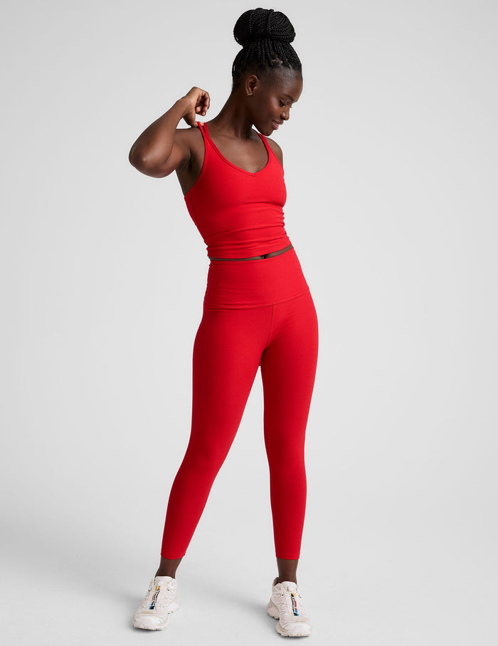 Red Spacedye Walk And Talk High Waisted Capri Legging on a model, featuring a high rise waistband and low calf length.