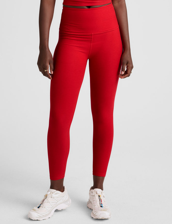 Red Spacedye Walk And Talk High Waisted Capri Legging shown on a model, featuring a wide waistband and low calf length.