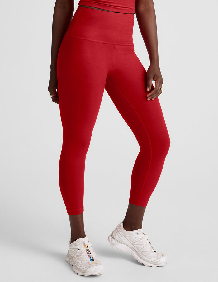 Red Spacedye Walk And Talk High Waisted Capri Leggings worn by a person, showing the snug fit and cropped low calf length.