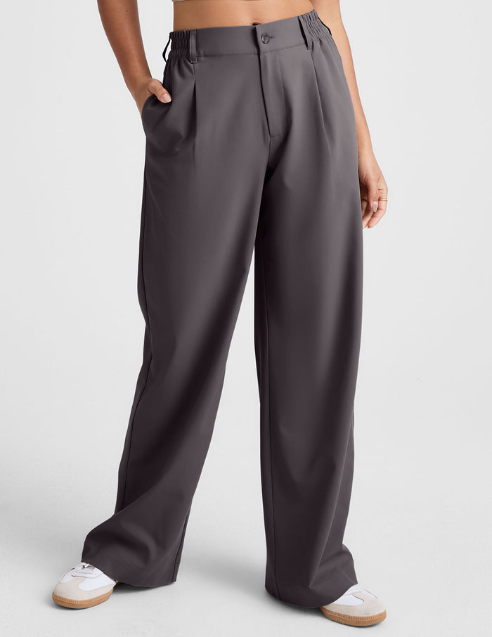 Charcoal Status Wide Leg Trouser on a model, featuring front pleats, elasticated waist, and a relaxed, full-length fit.