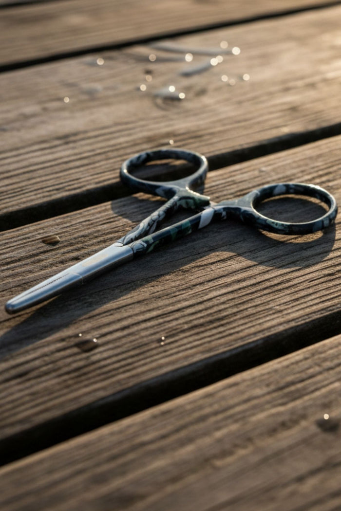 Pair of scissors on a wooden surface