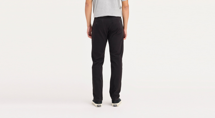 Back view of model wearing Black Ultimate Chinos, Athletic Fit.