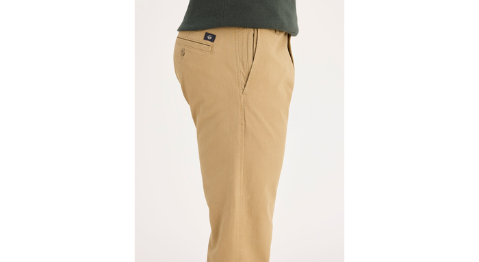 Side view of model wearing New British Khaki Ultimate Chinos, Athletic Fit.