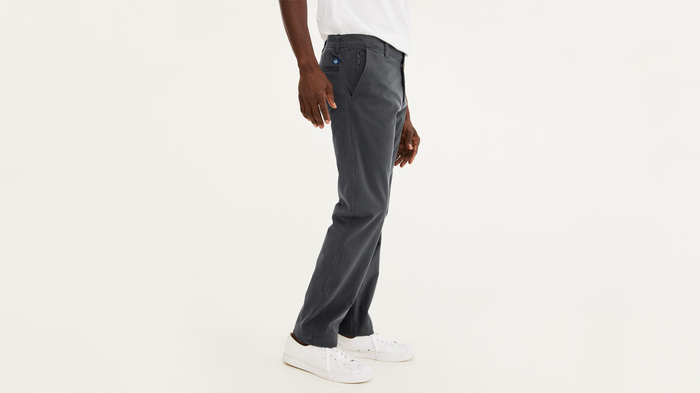 Side view of model wearing Steelhead Ultimate Chinos, Athletic Fit.
