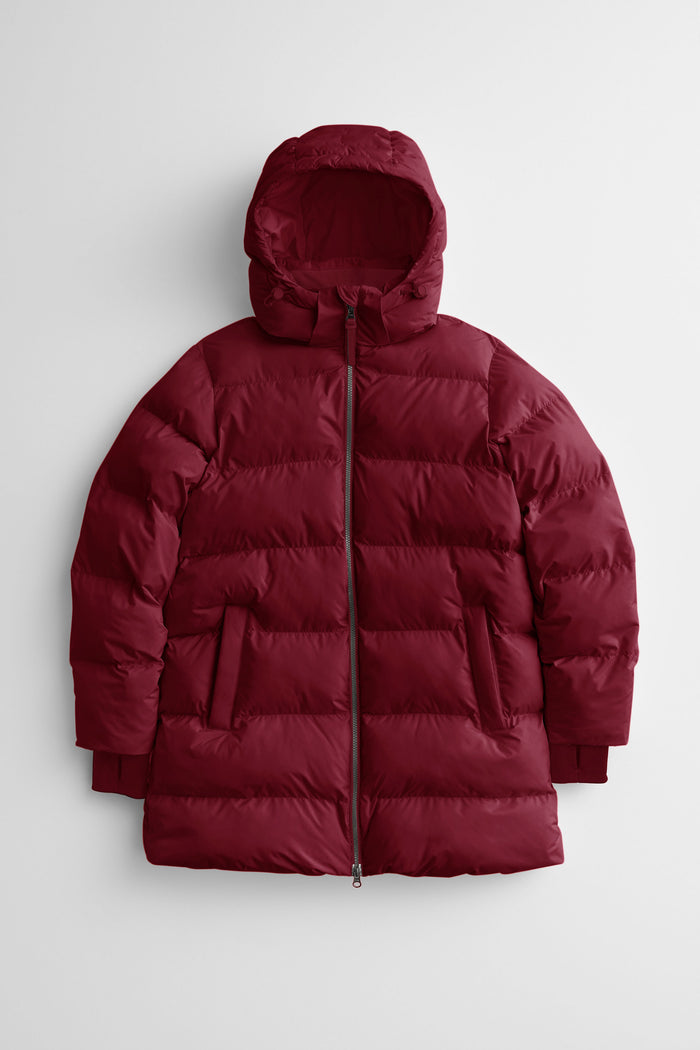 red puffer coat on a light gray background.