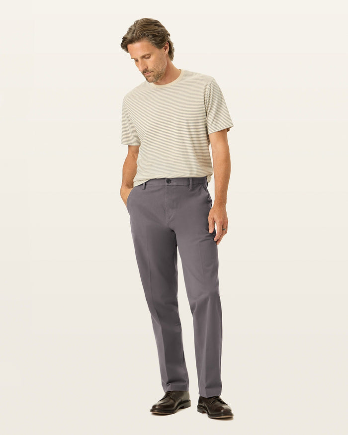 Front view of model wearing Storm Workday Khakis, Classic Fit.