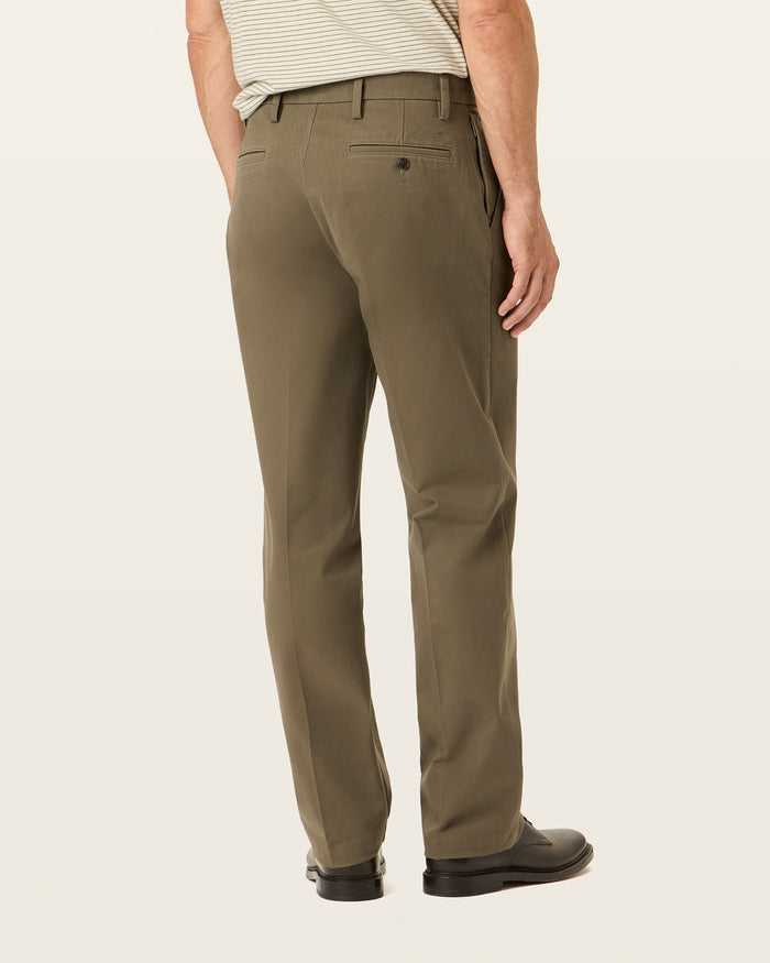 Side view of model wearing Dark Pebble Workday Khakis, Classic Fit.