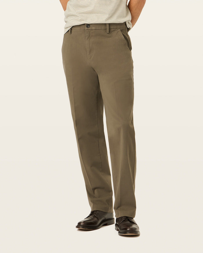 Back view of model wearing Dark Pebble Workday Khakis, Classic Fit.