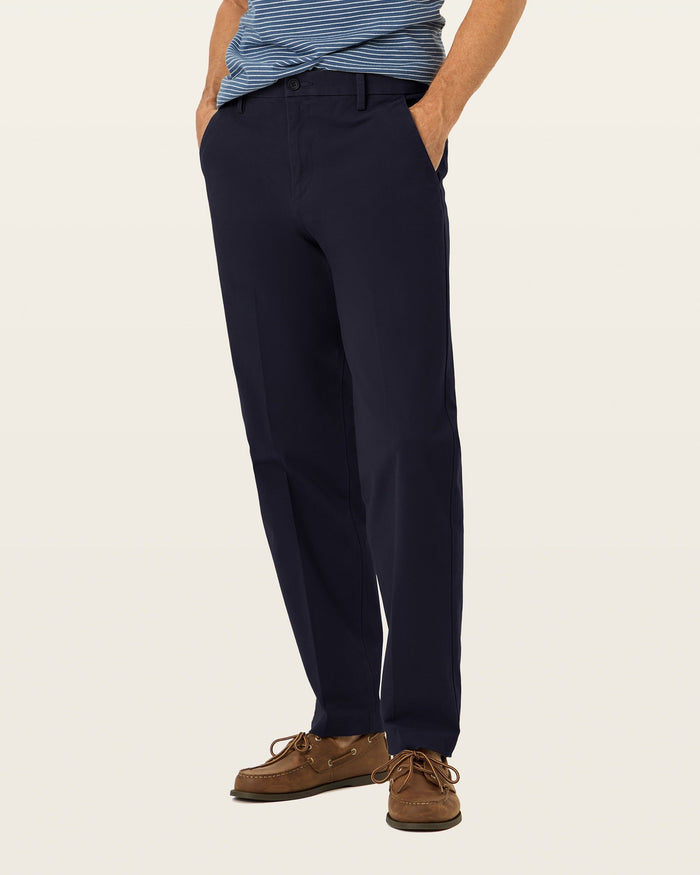 Side view of model wearing Pembroke Workday Khakis, Classic Fit.