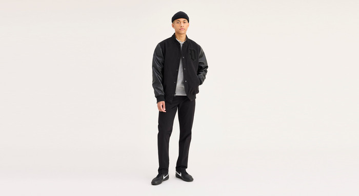 View of model wearing Black Workday Khakis, Slim Fit.