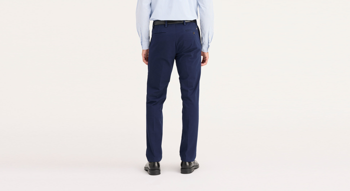 Back view of model wearing Pembroke Workday Khakis, Slim Fit.