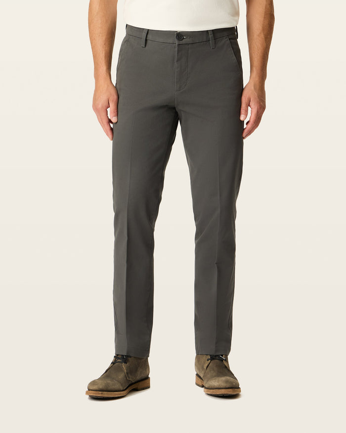 Front view of model wearing Storm Workday Khakis, Slim Fit.