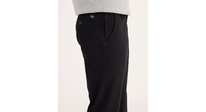 Side view of model wearing Black Workday Khakis, Slim Fit.