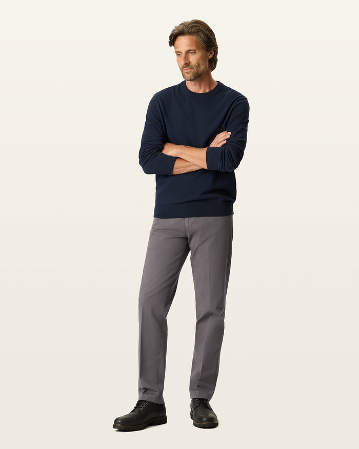 Front view of model wearing Storm Workday Khakis, Straight Fit.